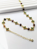 Collier Bloom – Ras de cou femme grenat hessonite et fleurs vertes dorées - Vatou Soa