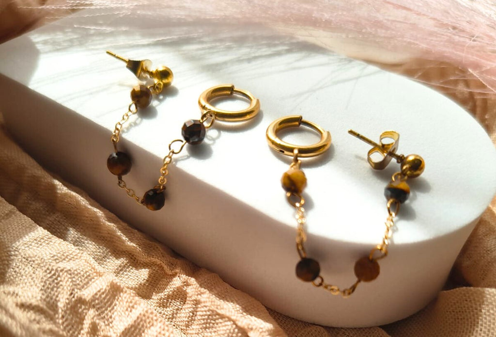  photo boucles d'oreilles multi-piercings oeil de tigre femme