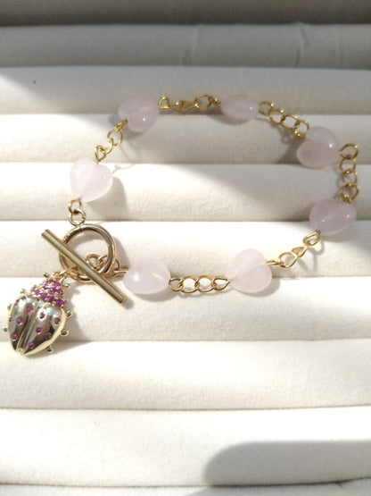 bracelet chaine acier inoxydadble quartz rose forme coeur 10mm avec charm coccinelle et fermoir T